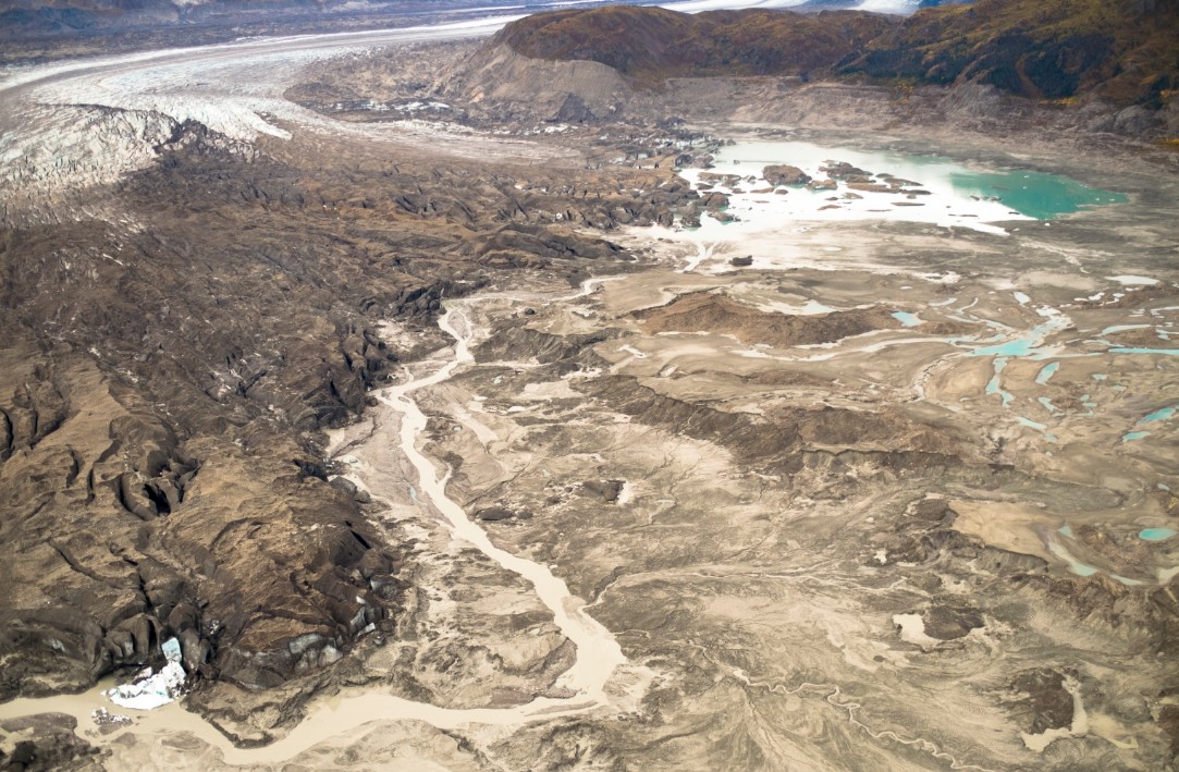 A September 2, 2016 aerial photo shows the meltwater stream along the toe of Kaskawulsh Glacier