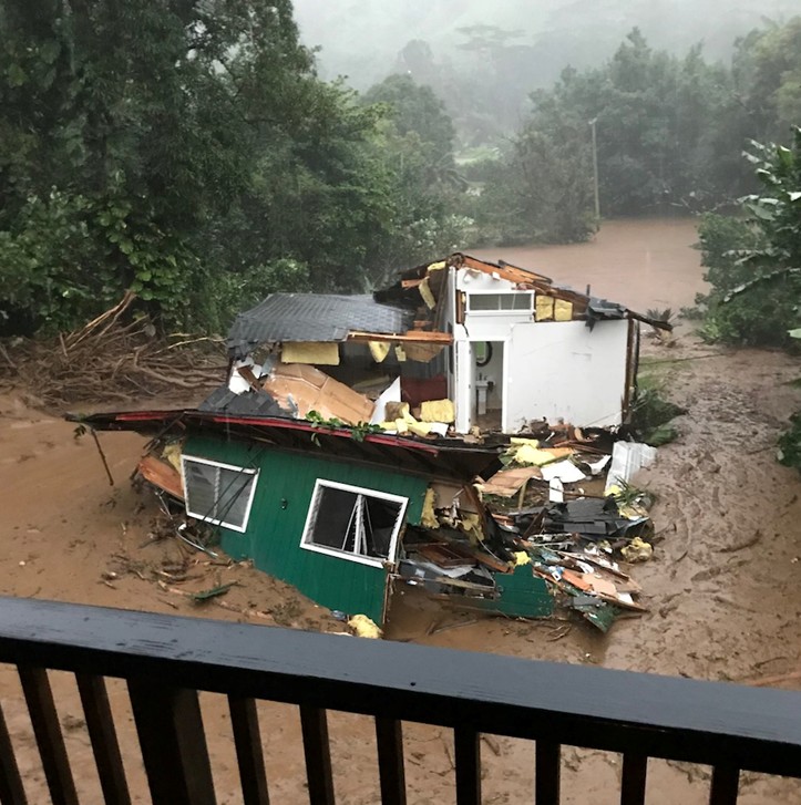 Floodwaters destroy a house in Kauai, Hawaii on April 14, 2018