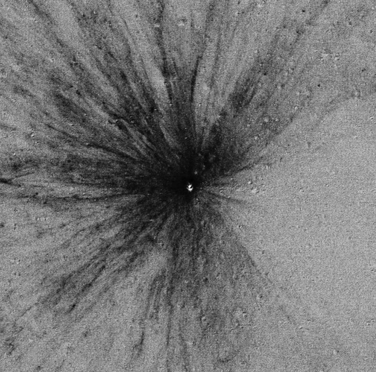 Temporal ratio image formed from two LROC Narrow Angle Camera images revealing a new 12 meter (~40 foot) diameter impact crater on the Moon