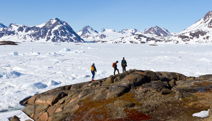 The scientists from University of Vermont, Imperial College, and Boston College looking over a frozen bay near Kulusuk, Greenland