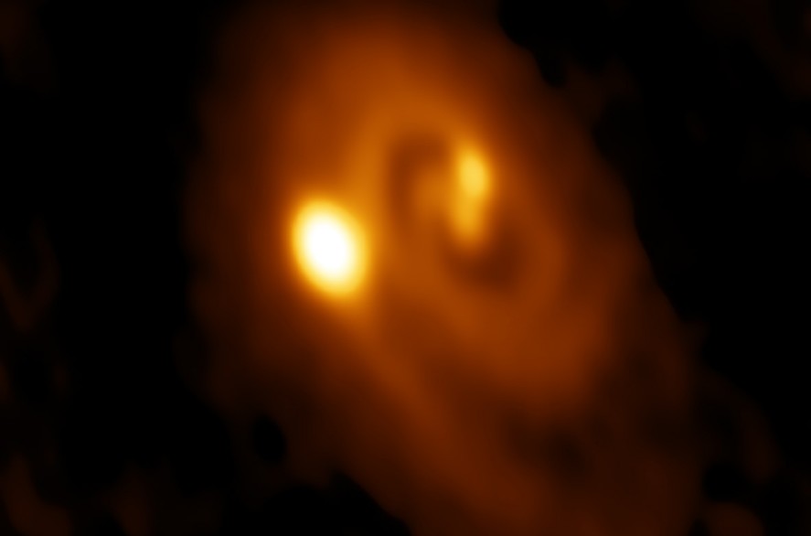 Triple star system forming in the Perseus molecular cloud